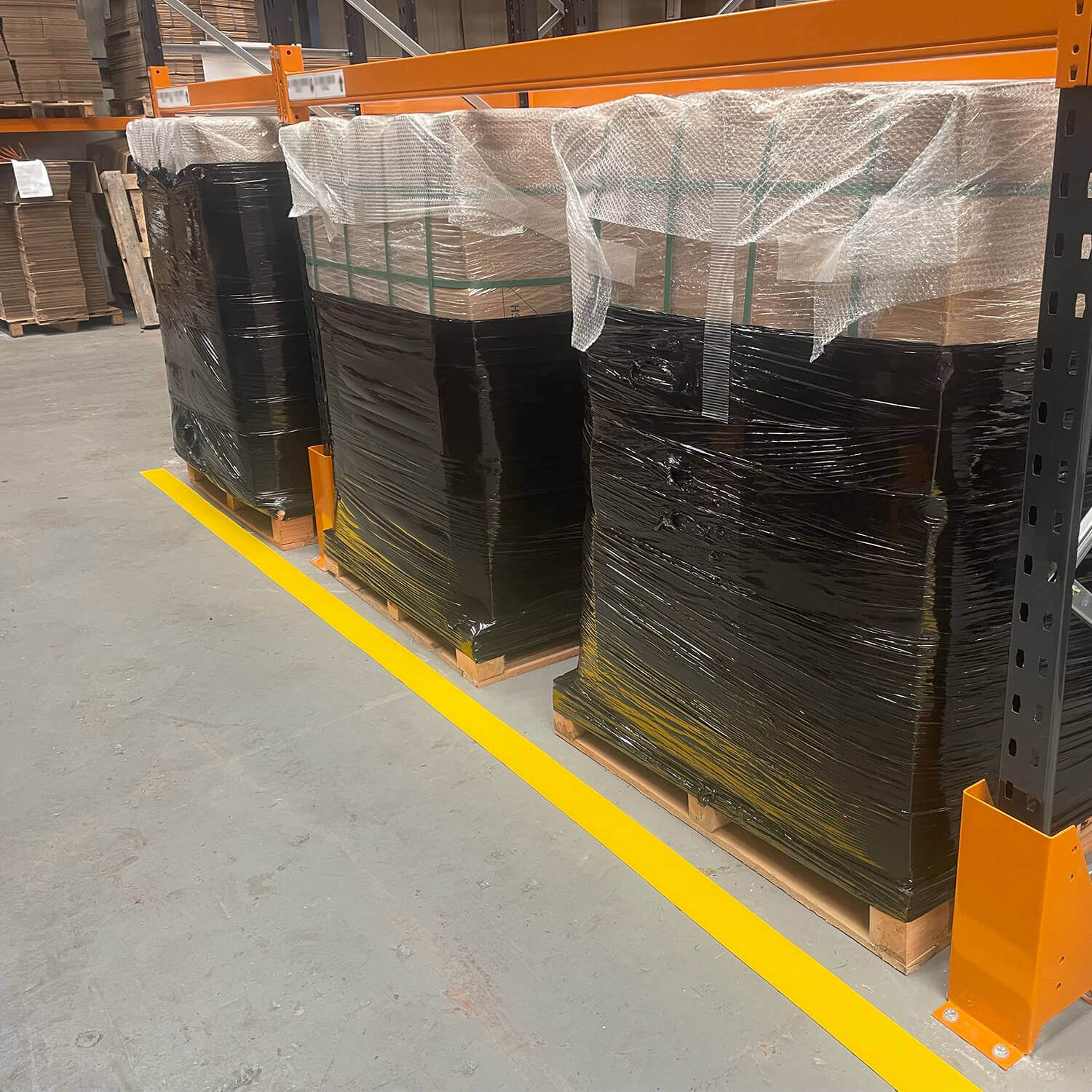 H6901Y Yellow PermaStripe 100mm Marking Tape on Warehouse Aisle Web